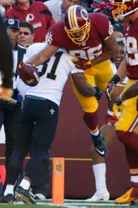 Washington Redskins tight end Jordan Reed (86) leaps over New Orleans Saints free safety Jairus Byrd (31) to score a touchdown during the first half of an NFL football game in Landover, Md., Sunday, Nov. 15, 2015. (AP Photo/Alex Brandon)