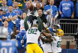 Green Bay Packers tight end Richard Rodgers (82) reaches to catch the game winning pass on the last play of an NFL football game against the Detroit Lions, Thursday, Dec. 3, 2015, in Detroit. The Packers defeated the Lions 27-23. (AP Photo/Duane Burleson)